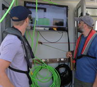 Bootcampers watch the AUV's progress on shipboard monitor