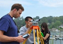 Students use surveying equipment to prepare for a mapping cruise.
