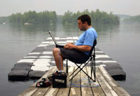 Roland uses his laptop to control an AUV in Mendum's Pond.