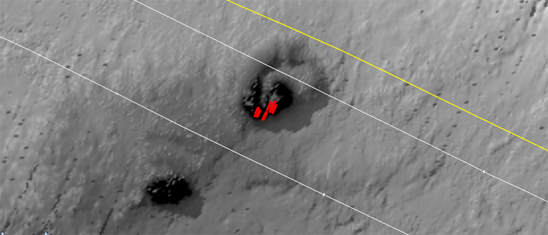 Seafloor image (plan view) in greyscale with red marks showing possible seeps.