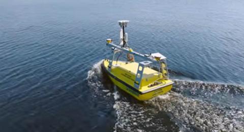 Yellow Echoboat ASV moving through the water.