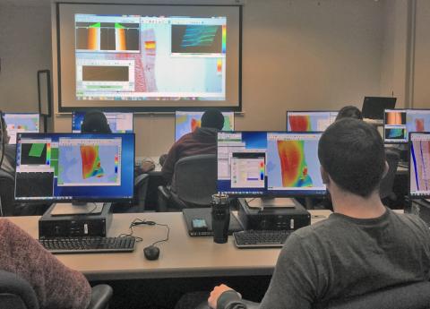 Students in computer lab with bathymetry on monitors