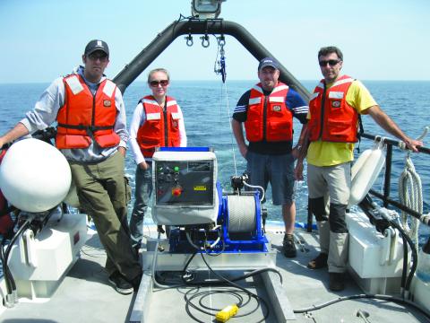 Researchers on fantail with a-frame